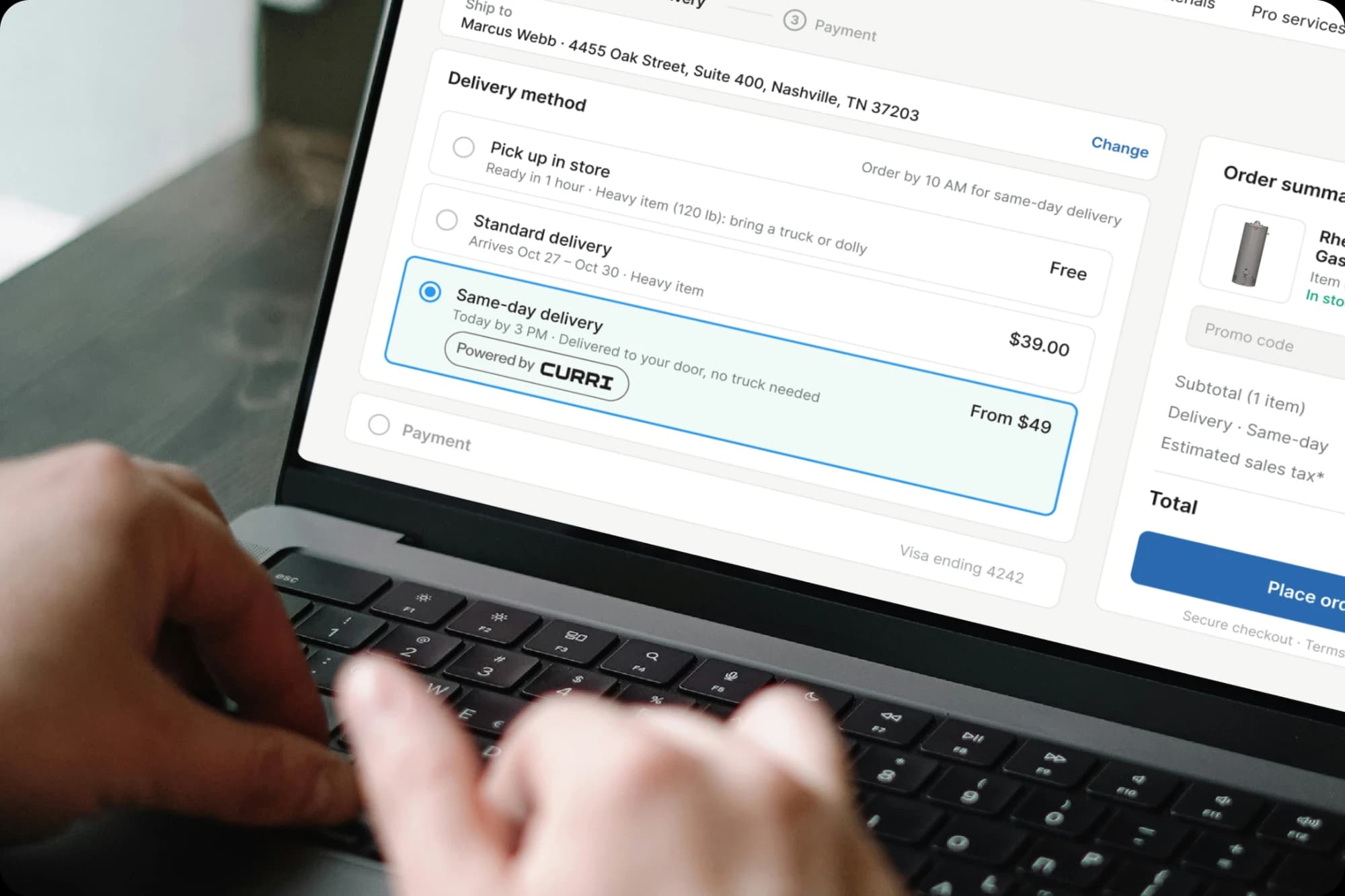 Close-up of a person typing on a laptop that shows a distributor checkout page with a highlighted same-day delivery option and a Powered by Curri badge
