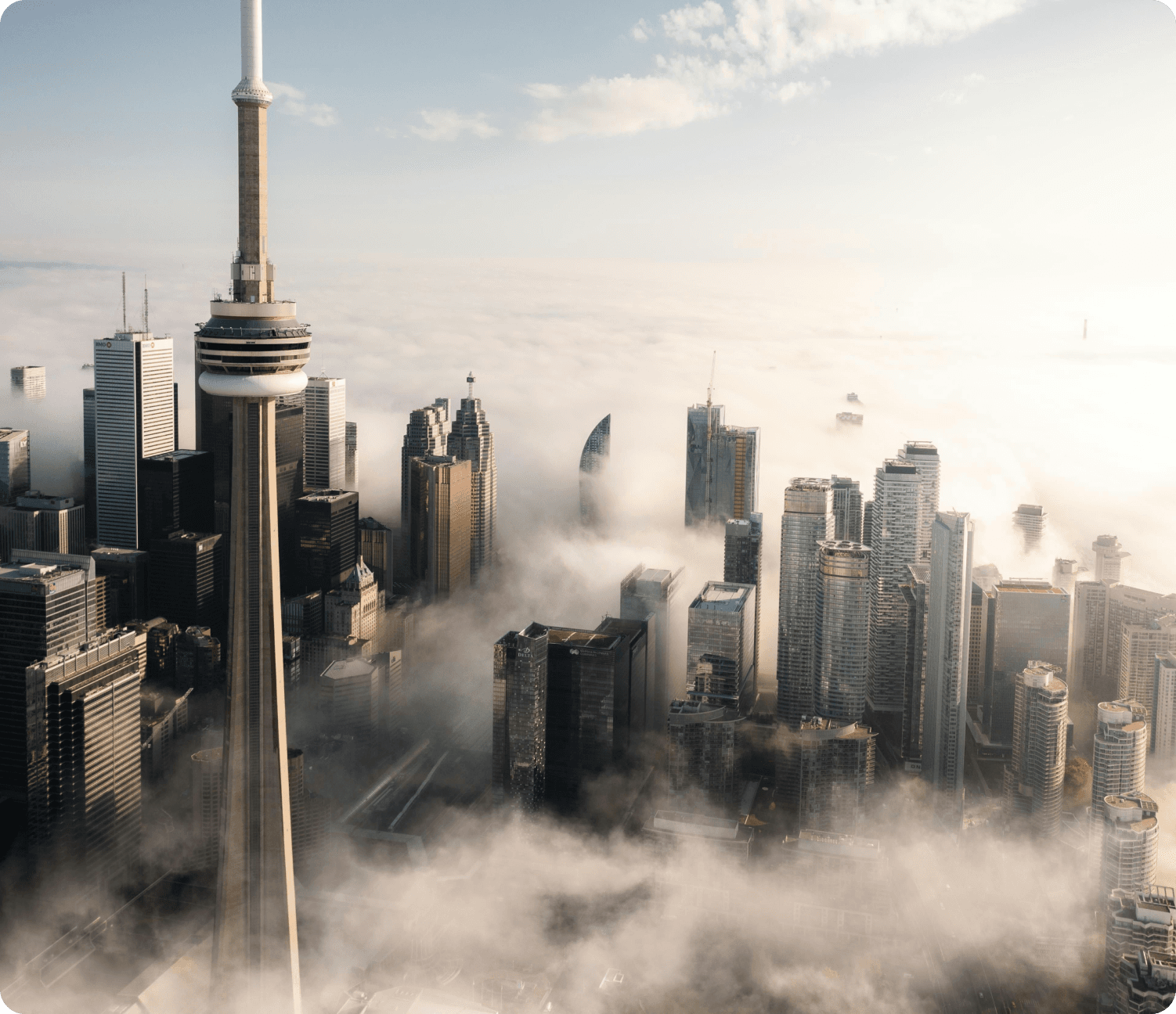 Toronto skyline with the CN Tower rising above the morning clouds