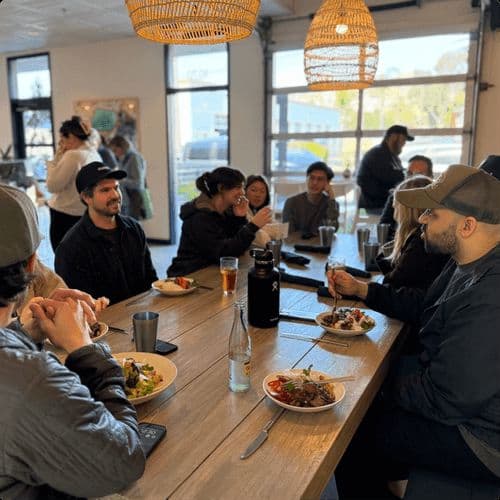 Curri team collaborating in an open workspace at the company headquarters