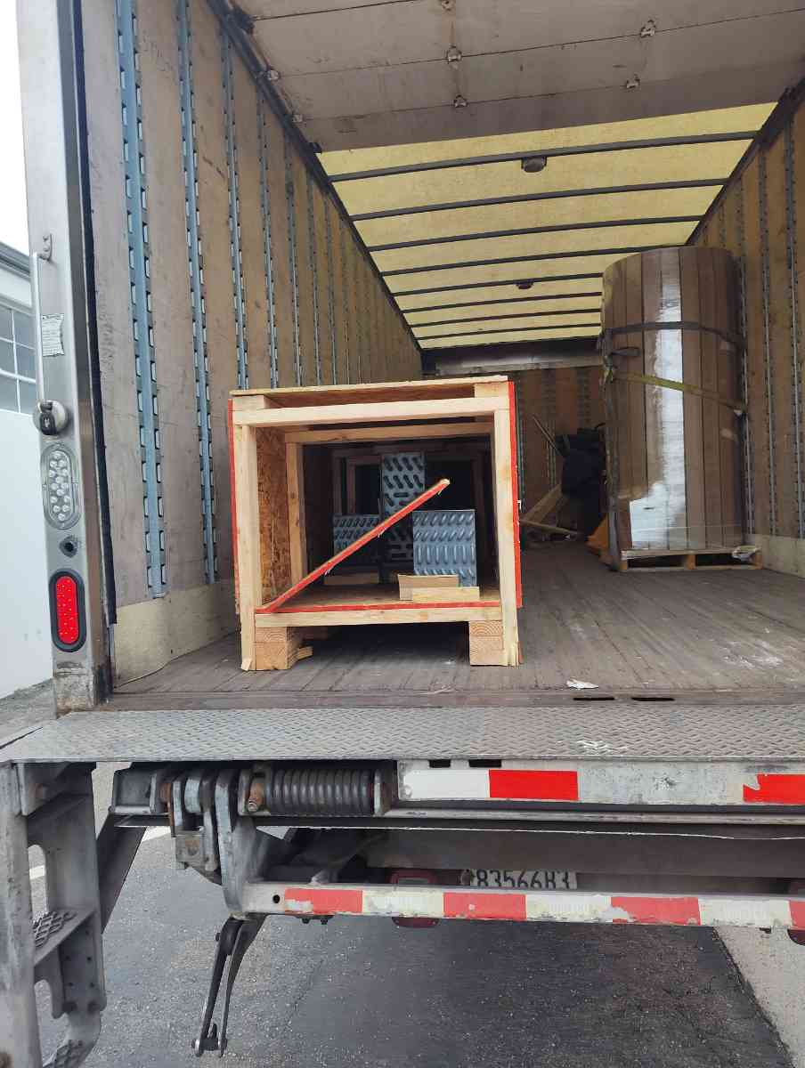 Dry van cargo bay loaded and secured for a Curri same-day freight delivery