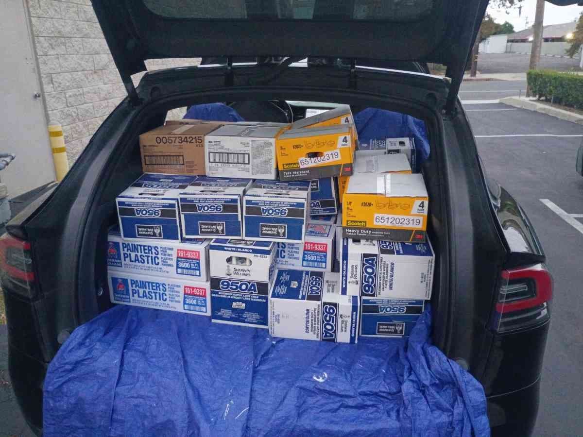 Curri SUV with the trunk loaded full of Sherwin-Williams paint boxes ready for a same-day trade-supply delivery