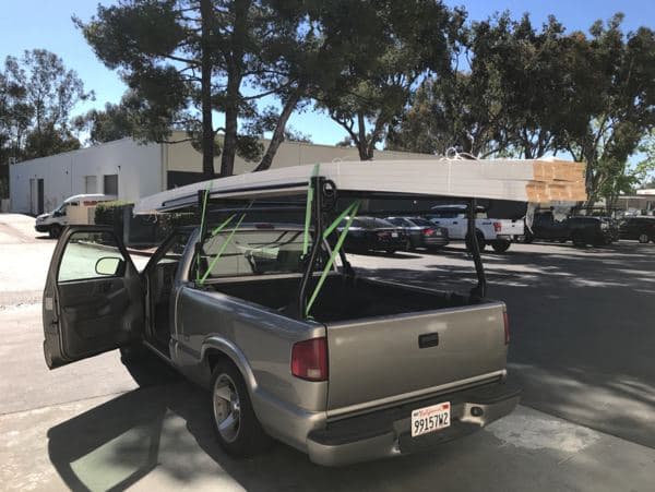 Supplies secured inside a cargo van for transport
