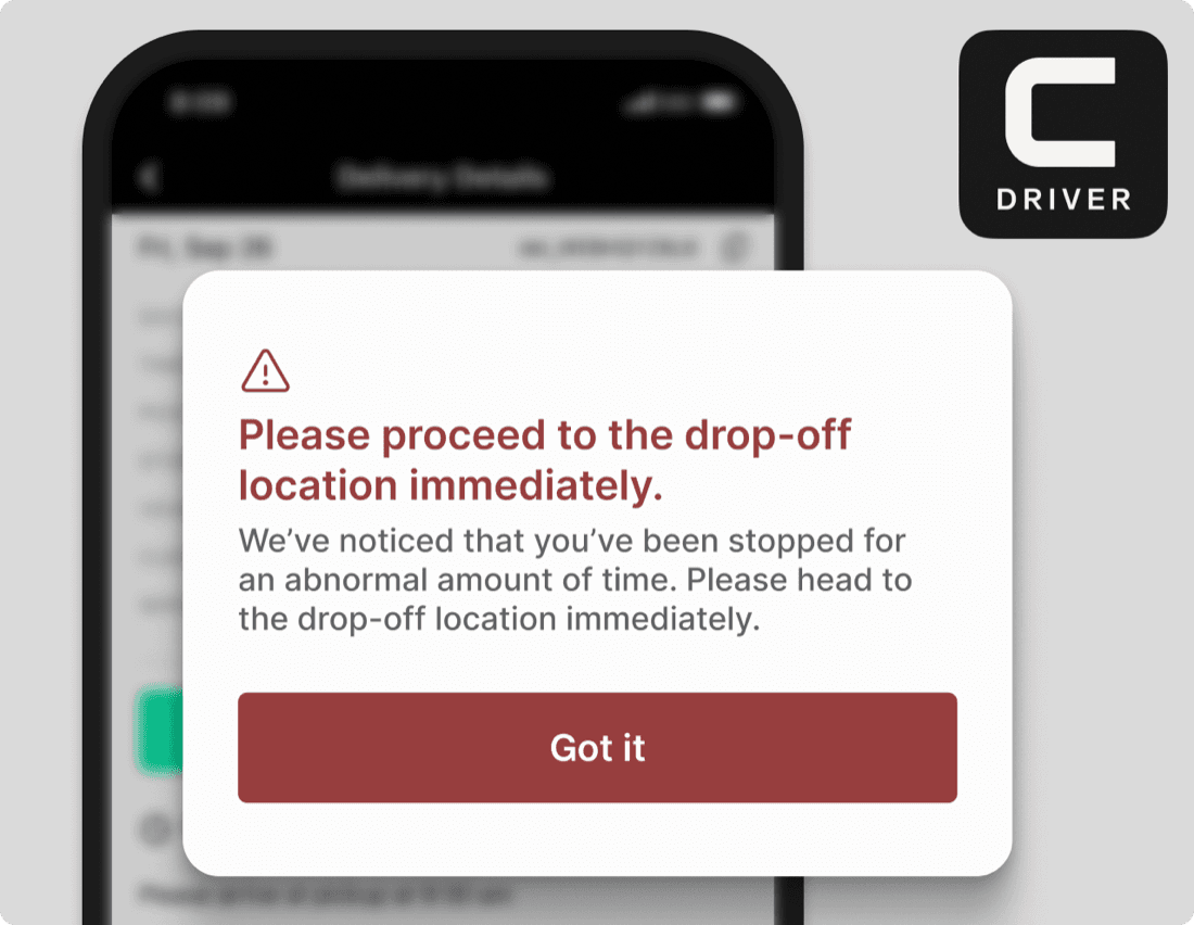 Curri Route Planner driver exception alert — in-app banner asking a driver to proceed to the drop-off location immediately after an abnormal stop, demonstrating automated self-healing route nudges
