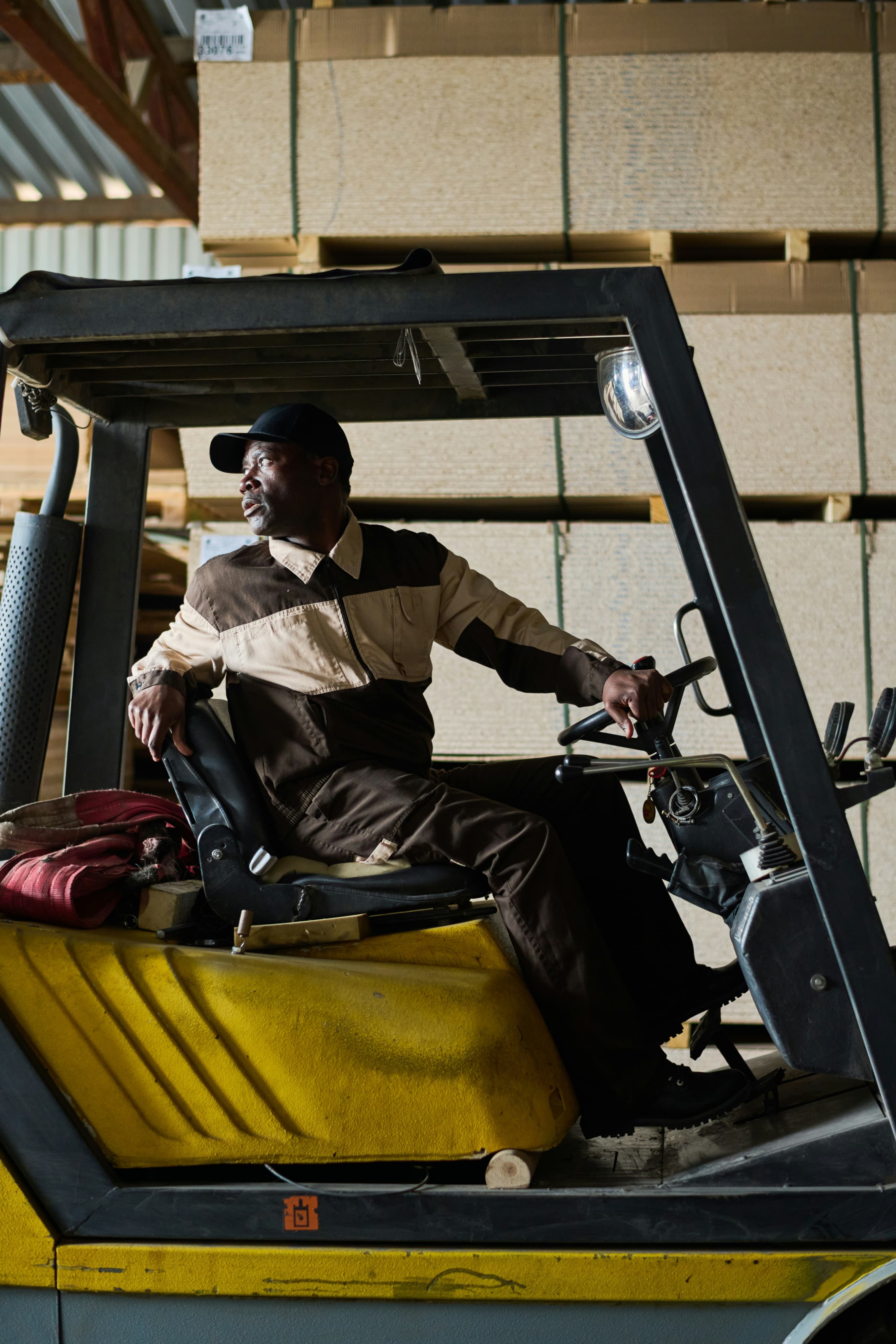 Curri driver inside a forklift, smiling